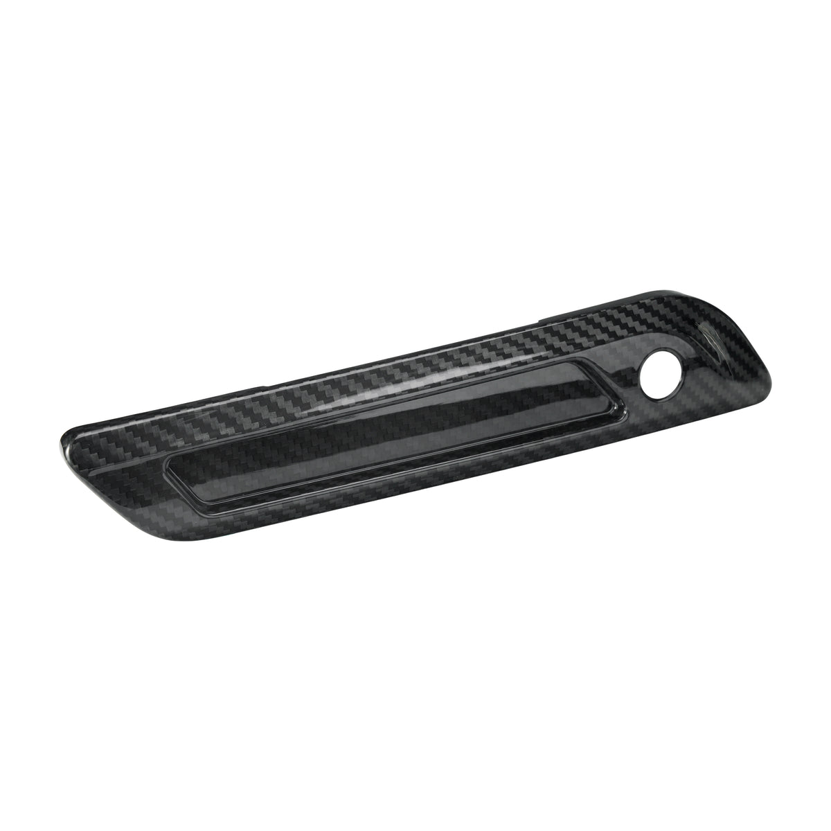 Angled left view of a carbon fiber saddlebag latch cover designed for a custom Harley Touring bagger build.