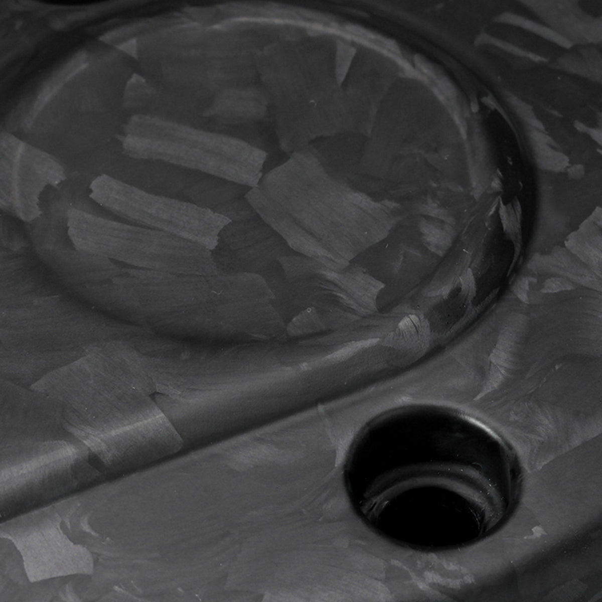 Detailed view of theForged Carbon Fiber Matt Finish texture and surface finish on a Harley Touring timer cover.