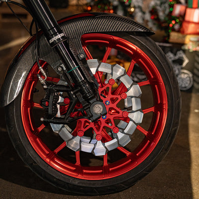 Front three-quarter view of a Harley-Davidson Touring performance bagger with a Y-Spoke forged wheel, inverted forks and custom fender.